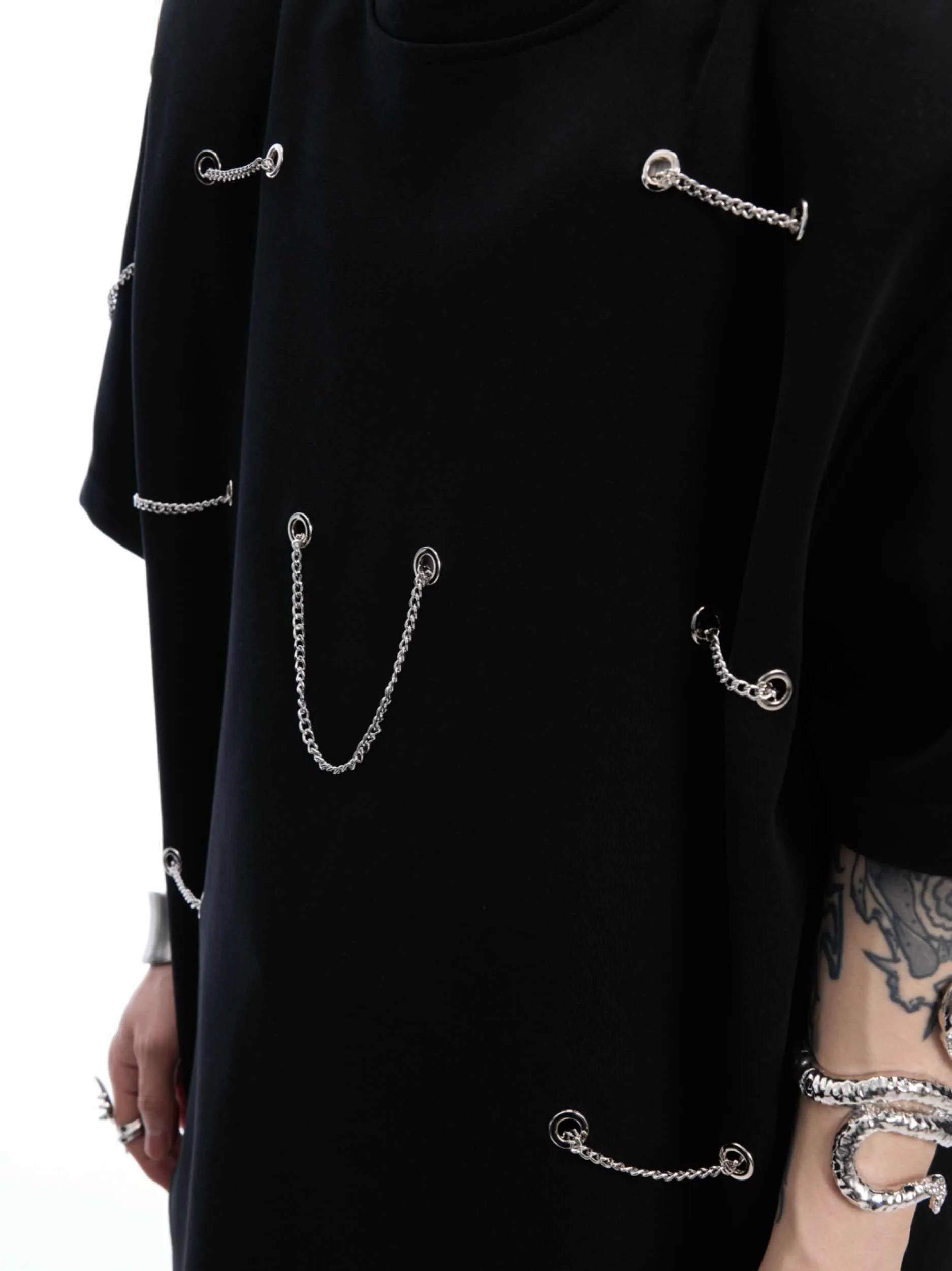 Black men's t-shirt with metal chain detail on front and padded shoulders, short sleeves, round neck, heavy cotton blend fabric