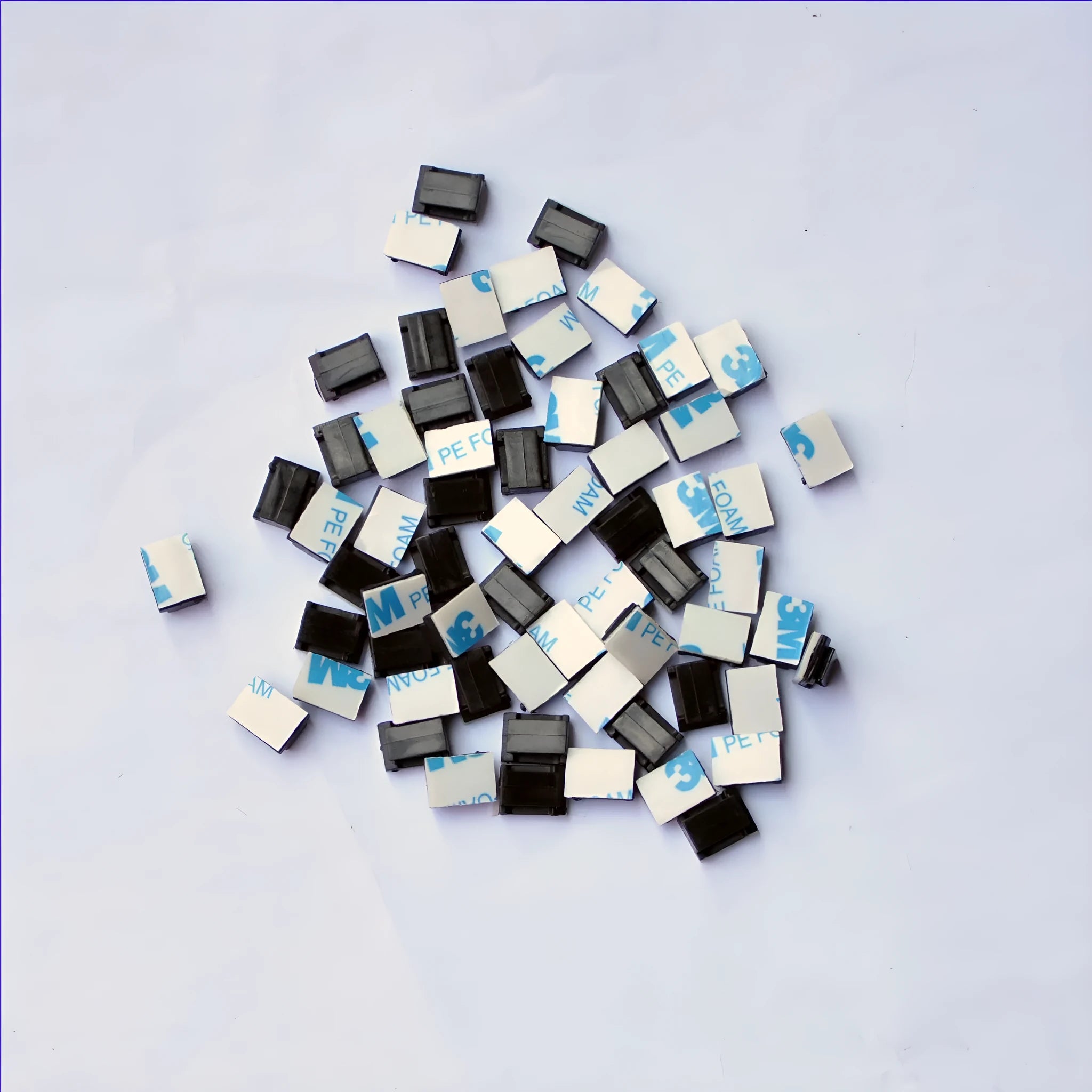 Black PA66 plastic automotive wire retaining clips for cable management in cars.