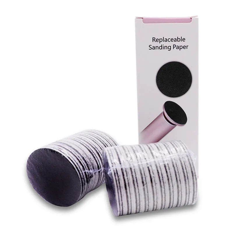 Electric foot callus remover with sandpaper disc attached for removing dead skin and calluses from heels
