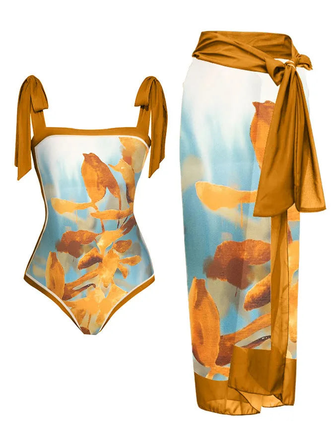 Women's floral print two-piece swimsuit with a sheer chiffon hip skirt, shown in one of the available colour variations.