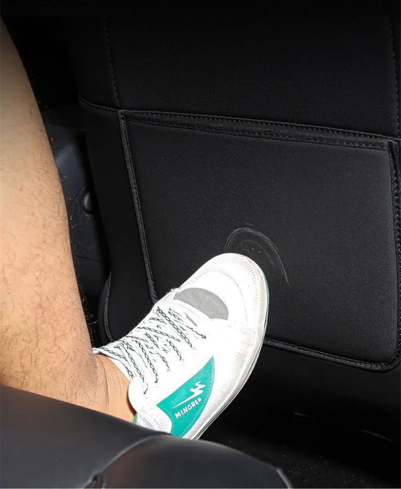 Black leather rear anti kick pad for car seat protection, showing single pocket and full coverage design