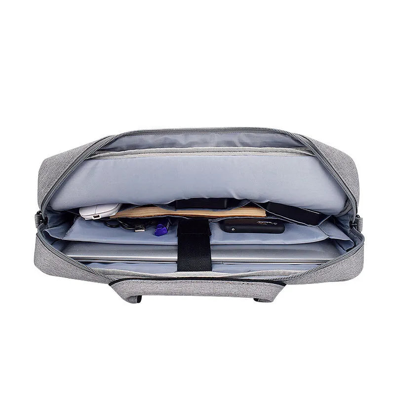 Black Oxford cloth laptop shoulder bag with matte finish, zipper closure, and soft handle for 15.6 inch laptop