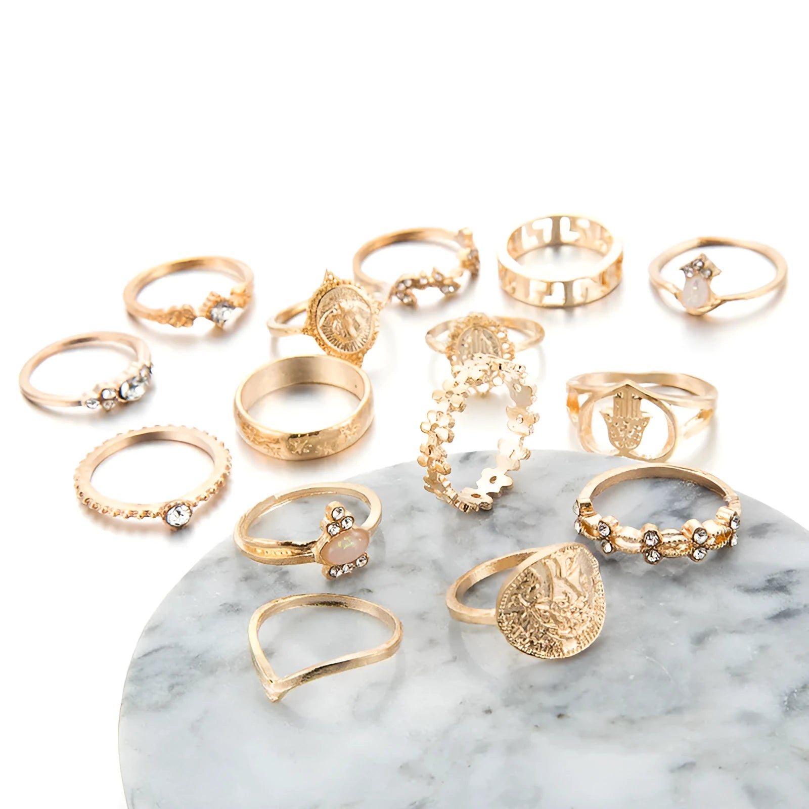 12-piece cross ring set in gold alloy on a flat surface, showing one size design