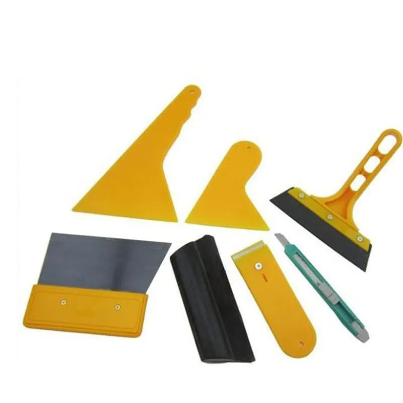 Seven-piece car film application tool set including scrapers, knives, and a pressing block on a white background.