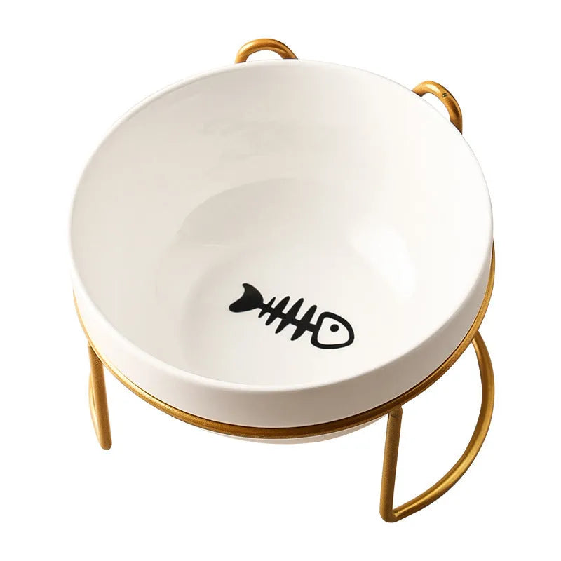 White ceramic cat bowl with cat paw print design on a black iron frame stand