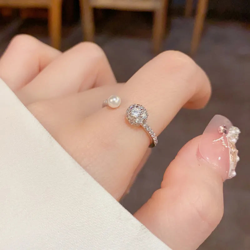 Open-end geometric pearl ring with round zircon accents in gold or silver finish