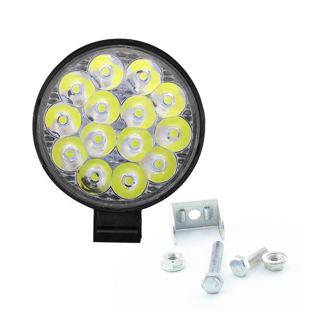 White mini round aluminium LED work light for car, truck, or boat with 42W power and IP67 rating.