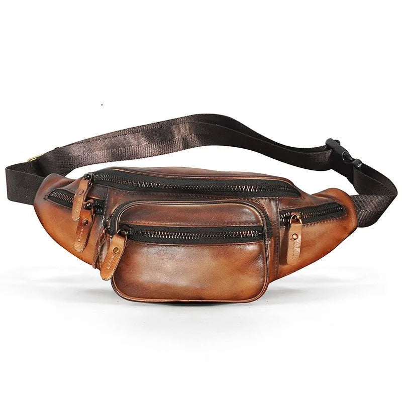 Brown leather shoulder messenger bag with a single strap and magnetic buckle closure.