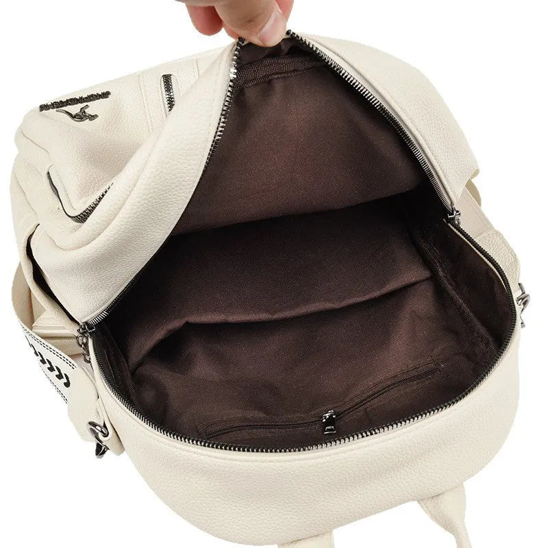 Genuine leather geometric patchwork student backpack with metal belt decoration, waterproof and wear-resistant, in black beige and yellow