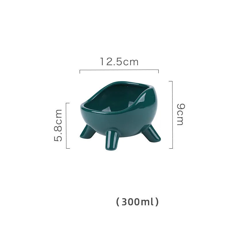 Green ceramic pet bowl with four legs and wide-mouth design for cats and small dogs