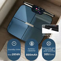 Black eight-electrode body fat scale on a floor, showing a simple rectangular design.