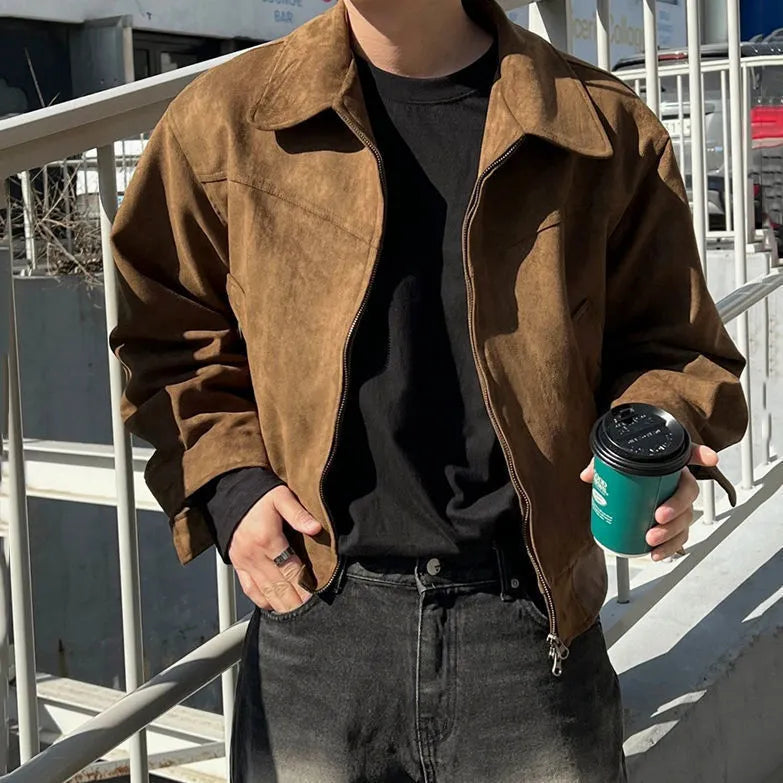 Short jacket with loose lapels in brown suede-style fabric, front view, on a plain background.