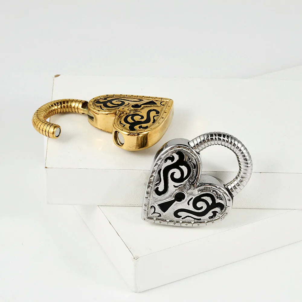 Heart-shaped stainless steel ear piercing stud with electroplated gold finish on white background
