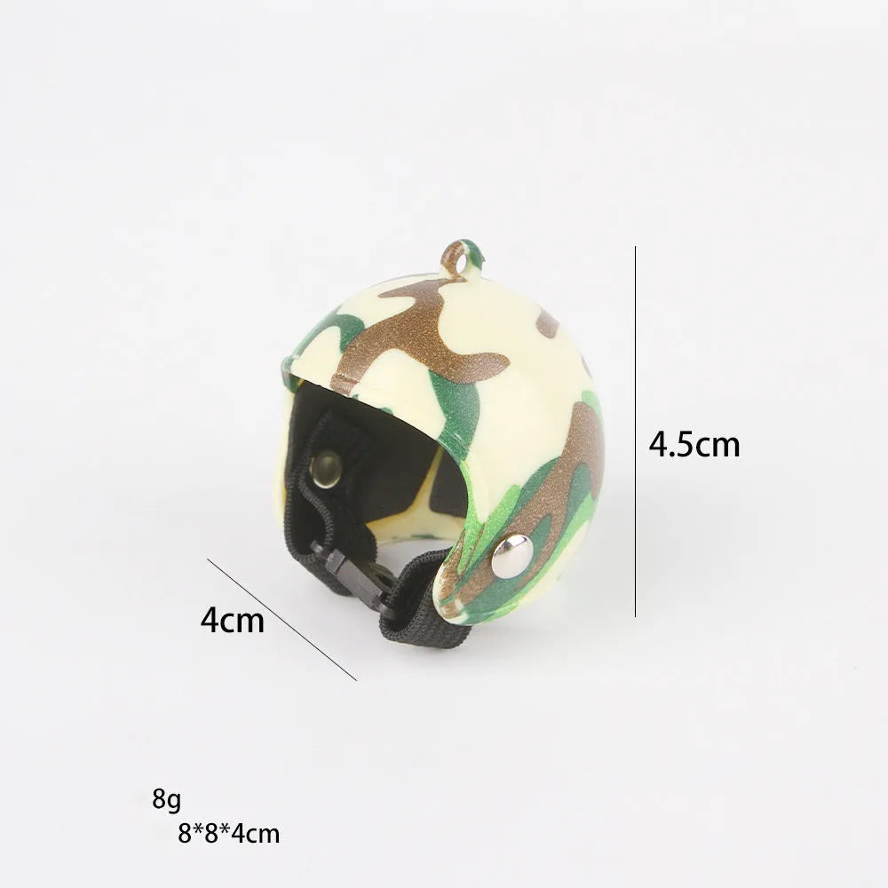 Small adjustable plastic safety helmet for a chicken or bird, shown in a fun design.