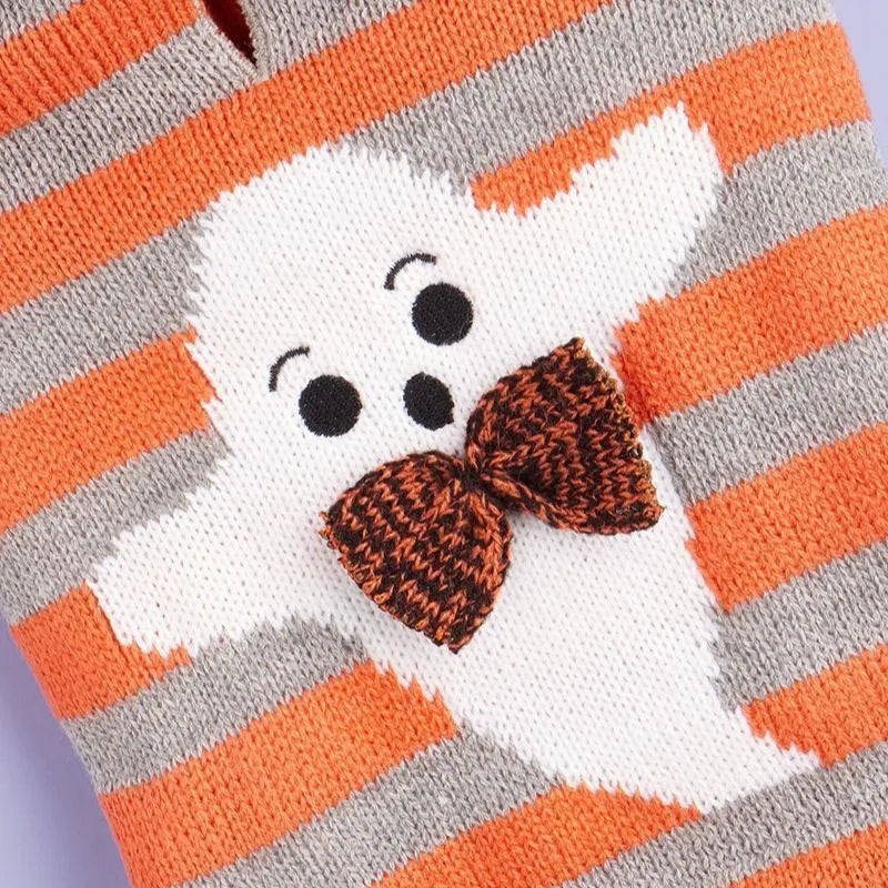 Orange striped Halloween hooded sweater for pets with fur balls on a hanger
