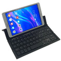 Black mini folding Bluetooth keyboard for tablets showing numeric keypad and compact 5-inch design