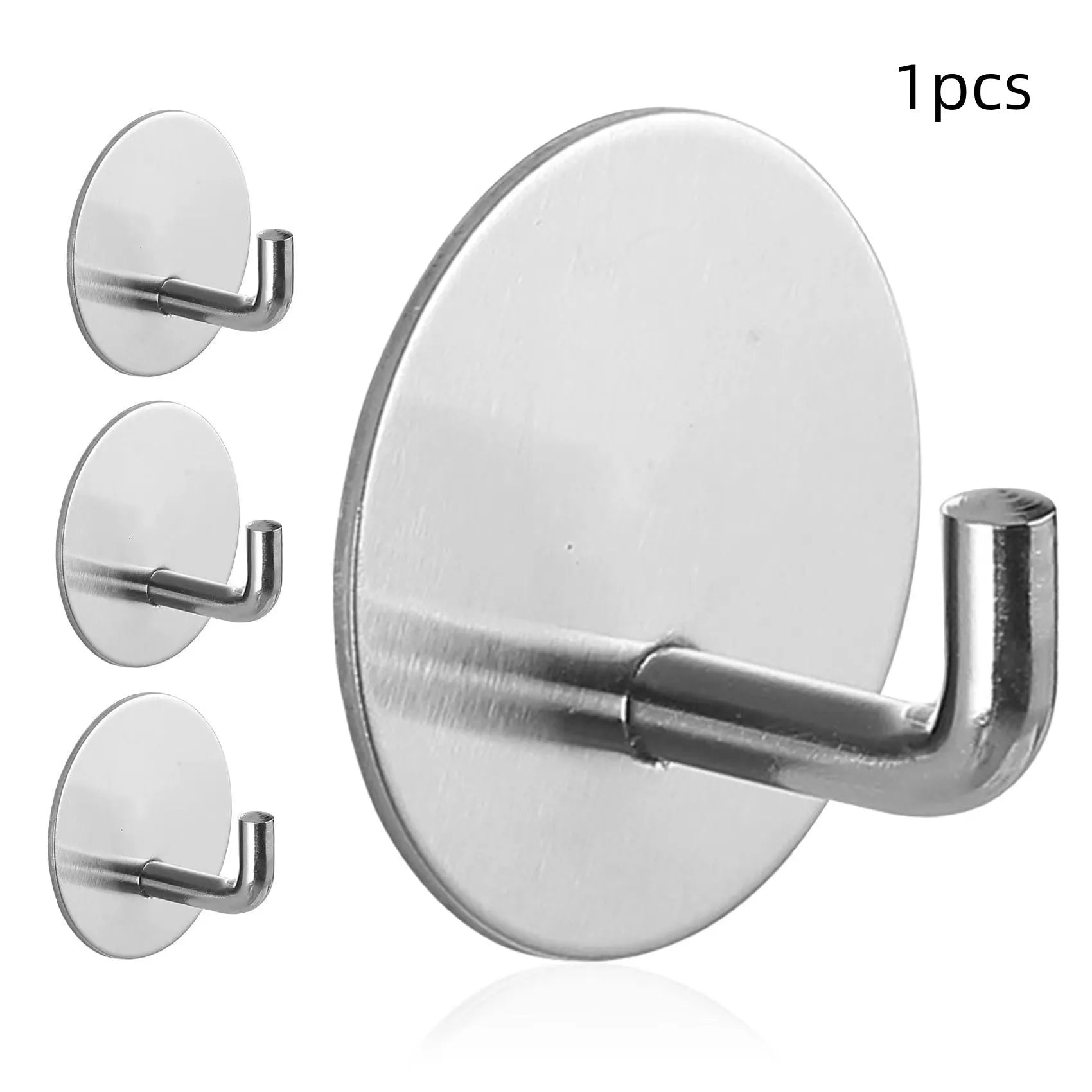 Stainless steel round self-adhesive hook for wall mounting.