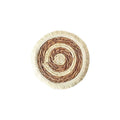 Round Japanese straw placemat with corn rope tassel detailing on wooden table