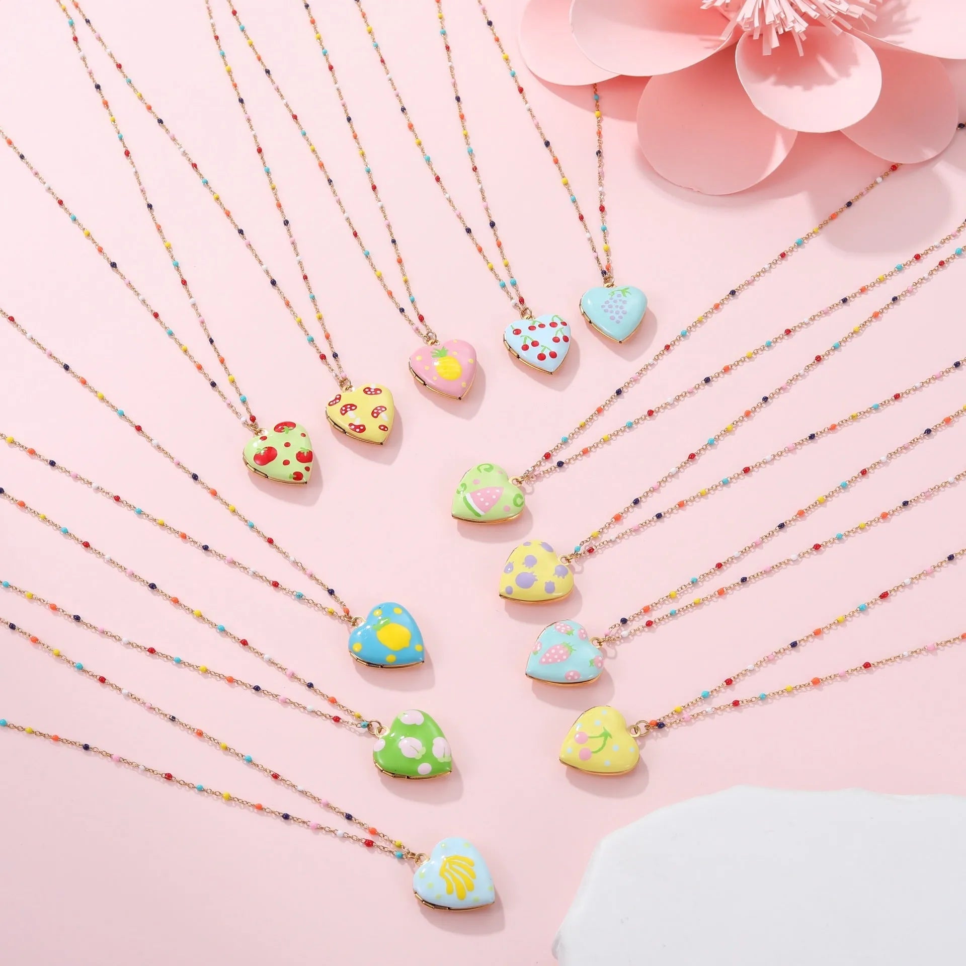 Gold-plated stainless steel necklace with heart-shaped fruit pendant on an adjustable chain.