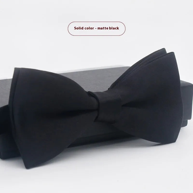 Solid colour flat head bow tie for formal wear in multiple colours including black, red, and blue.