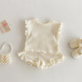 Baby girl two-piece cotton shorts set in light beige with wooden ear vest top and matching shorts