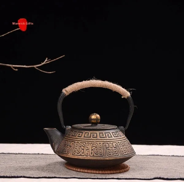 Japanese style cast iron teapot with traditional design and 0.9L capacity for tea brewing