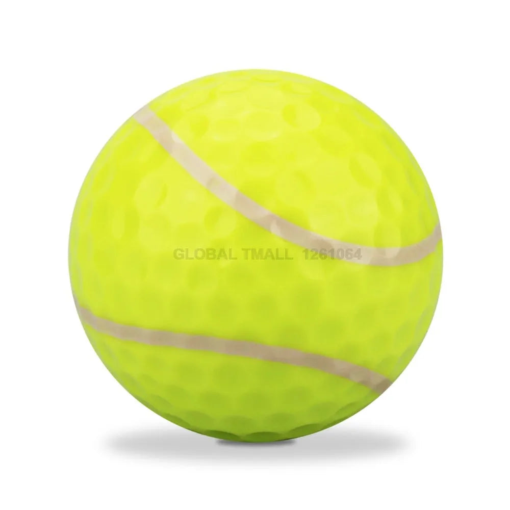 Golf practice ball with Surlyn cover and seamless dimple design, random colour, on green surface