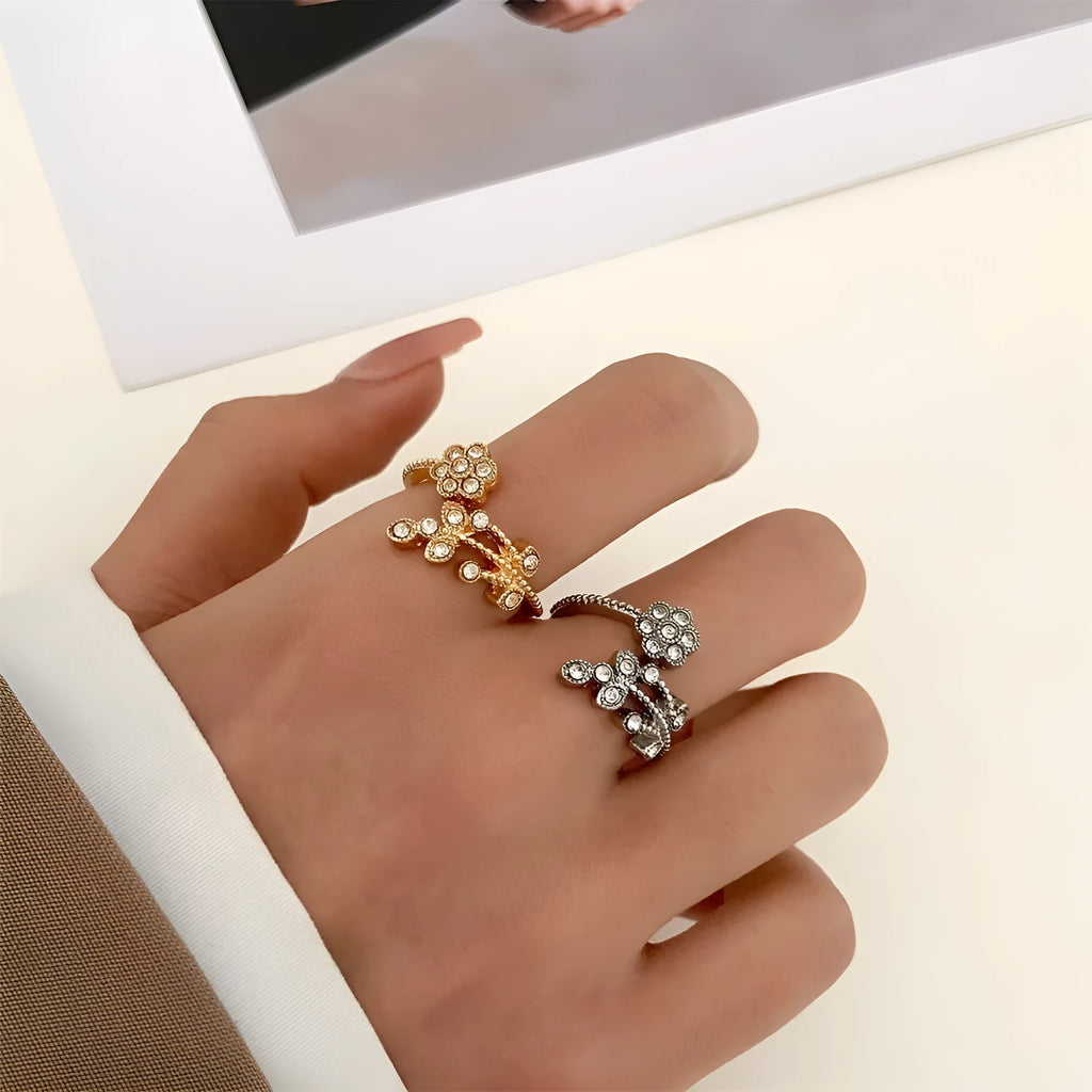 Copper open-ring with diamond-treated floral pattern and leaf details in gold colour