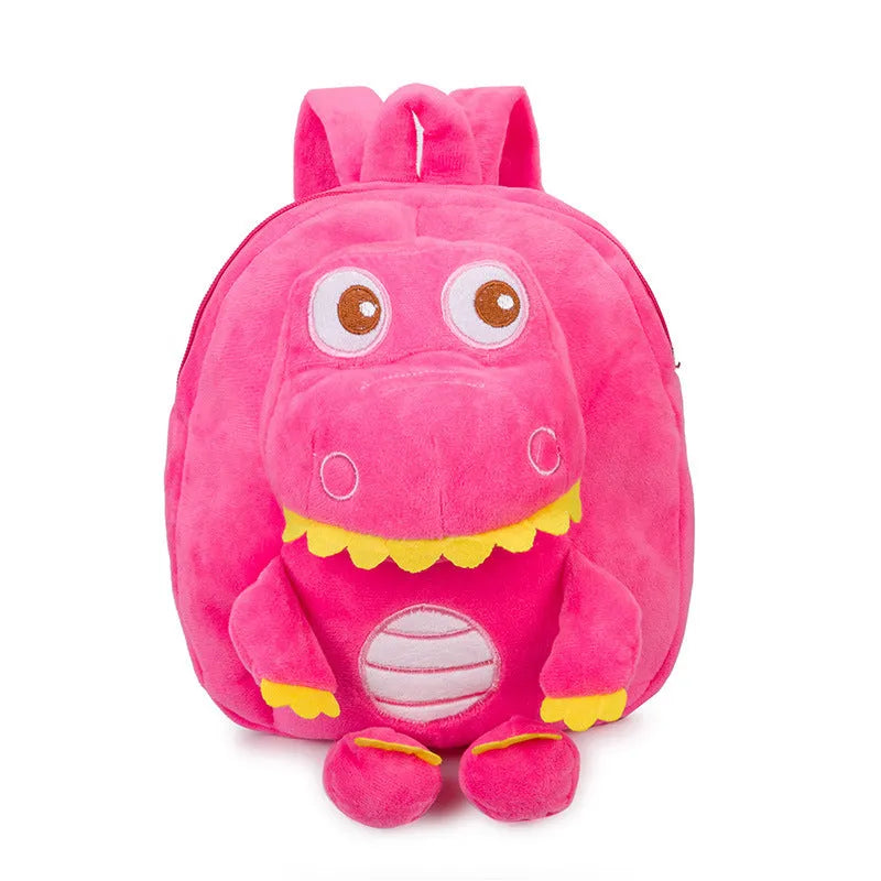 Soft blue dinosaur plush backpack for children with embroidered dinosaur pattern and a soft handle.