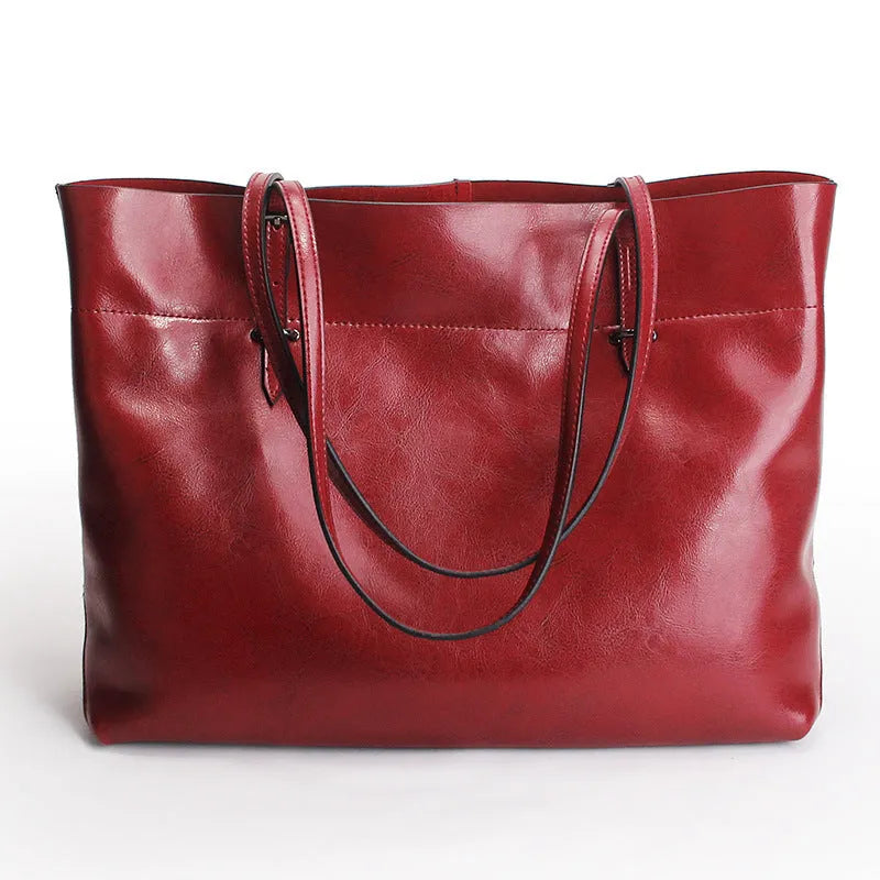 Horizontal waxed cowhide leather crossbody handbag for women showing internal compartments.