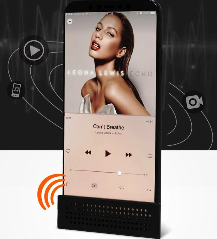Portable black ABS mobile phone amplifier bracket holding an iPhone on a desk.