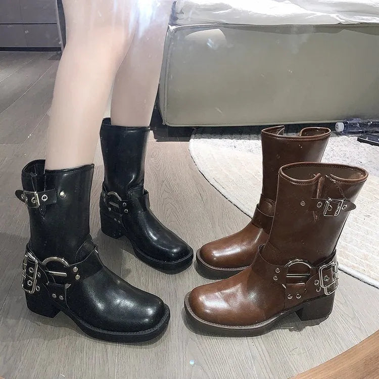 Women's black platform boots with belt buckle detail and lace-up closure, mid-calf length