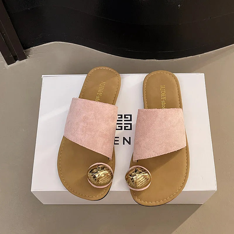 Women's flat bottomed French toe flip flops in solid colours on a light background