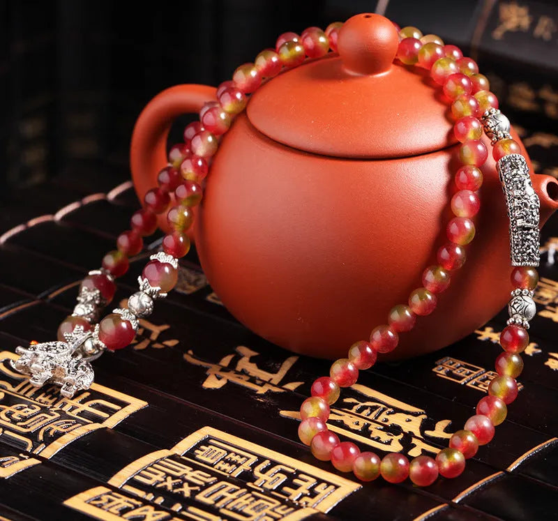Handmade natural watermelon crystal bracelet with Chinese knot fastening and geometric beads