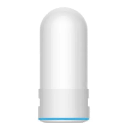 White plastic kitchen tap water filter with ceramic cartridge and universal adapter kit on a counter.