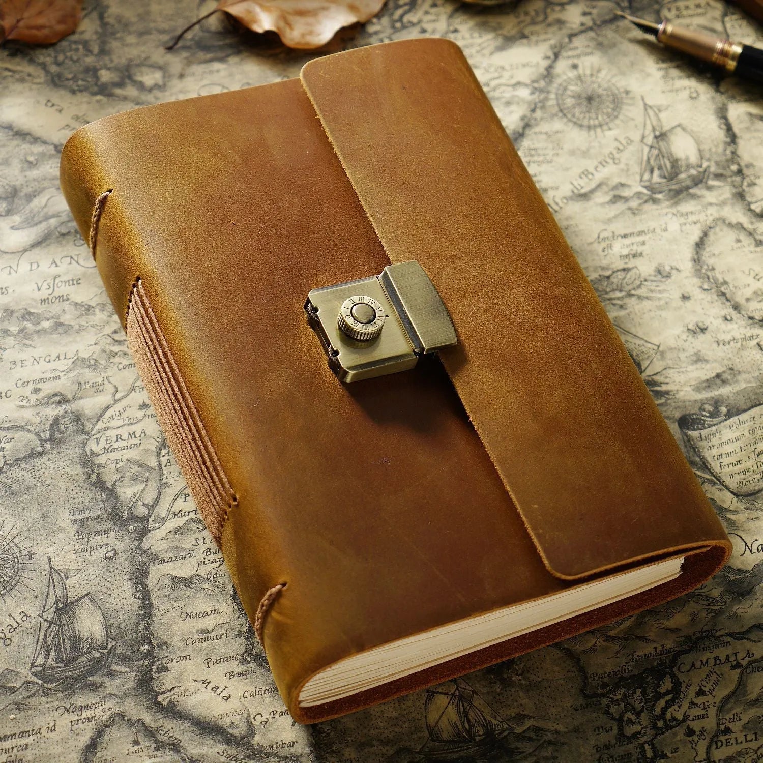 Vintage cowhide leather journal open on blank brown paper pages, A5 size, Crazy Horse brown colour with distressed finish