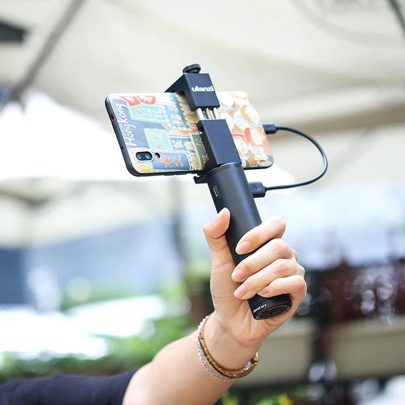 Black aluminium alloy handle-shaped power bank with 6800mAh capacity, shown next to a mobile phone.