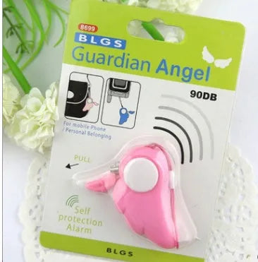Blue personal security alarm with clip attached to a handbag strap, showing compact size and pull-rope mechanism