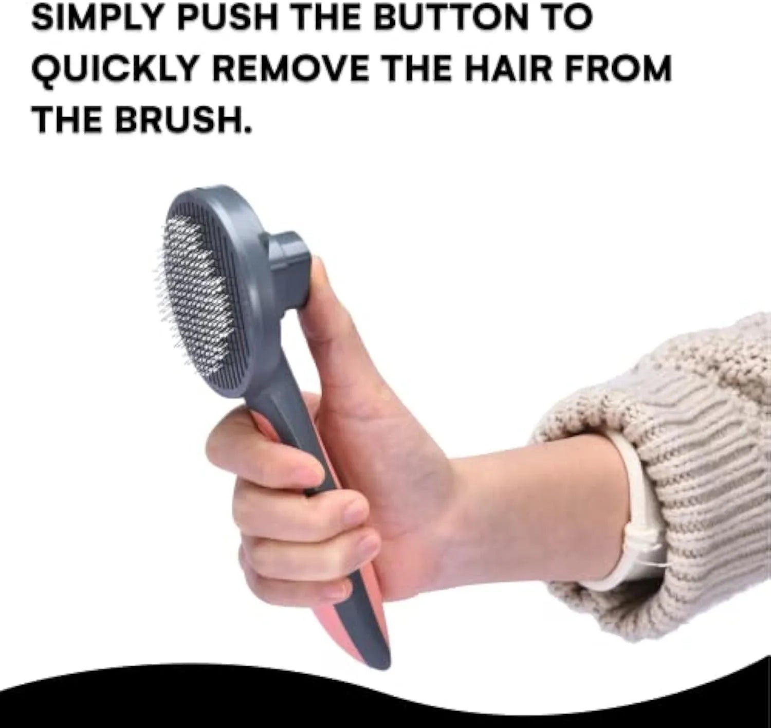 Grey self-cleaning slicker brush for grooming cats and dogs on a wooden table.