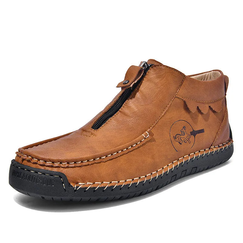 Men's black slip-on leather loafers with a round toe and rubber sole on a plain background.