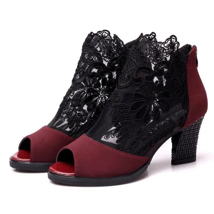 Women's black lace gladiator sandals with square high heel and zip closure, showing flower pattern detail