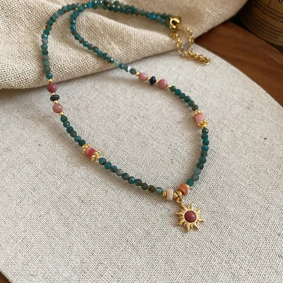 Freshwater pearl sun necklace on clavicle chain in court style, blue-sun colour option.