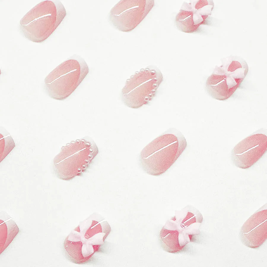 Short French manicure nail art set with tulip patterns and bow designs