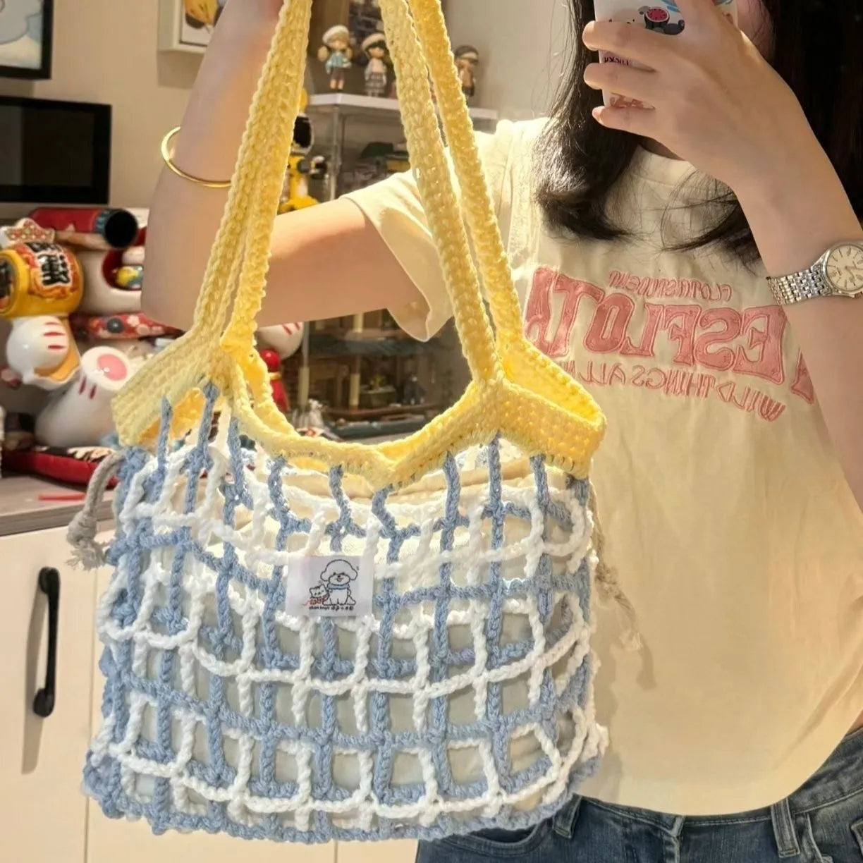 Handwoven wool floral handbag in summer style with natural pattern