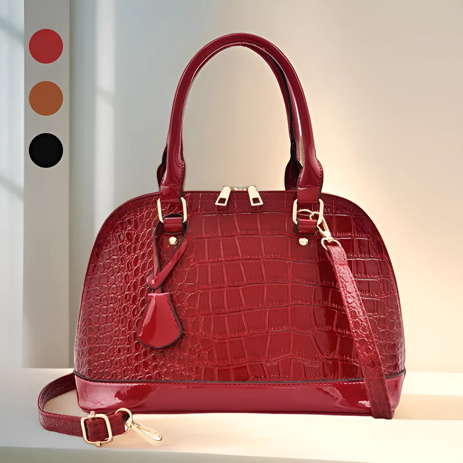 Shiny black PU crossbody bag showing structured shell shape and dimensions