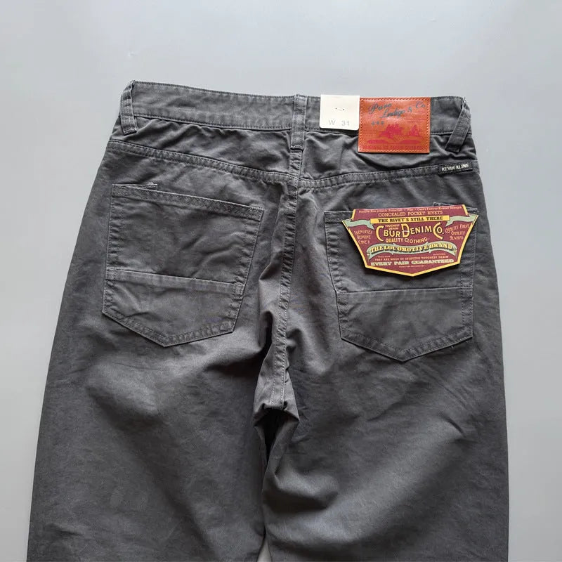 Men's straight-leg cotton casual trousers in army green colour, laid flat to show mid-waist and trousers length.