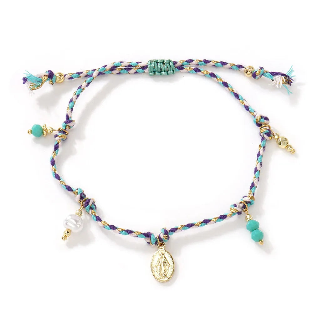 Hand-woven women's bracelet made from colourful braided rope with an integrated carrying strap tag design.