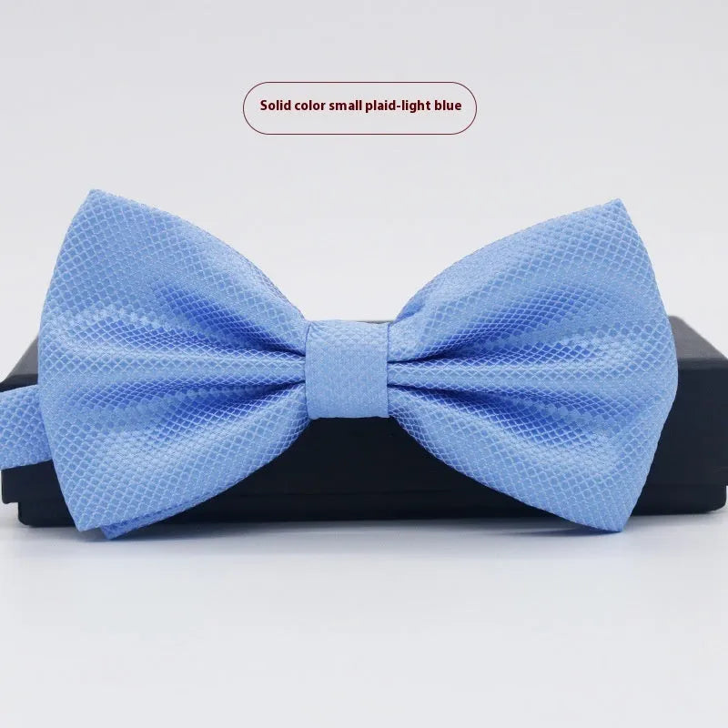Solid colour flat head bow tie for formal wear in multiple colours including black, red, and blue.