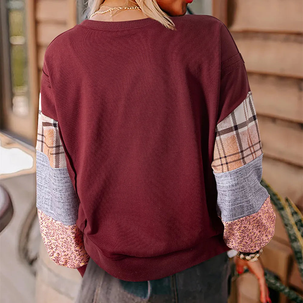 Women's loose plaid long-sleeved casual top in apricot colour on a hanger.