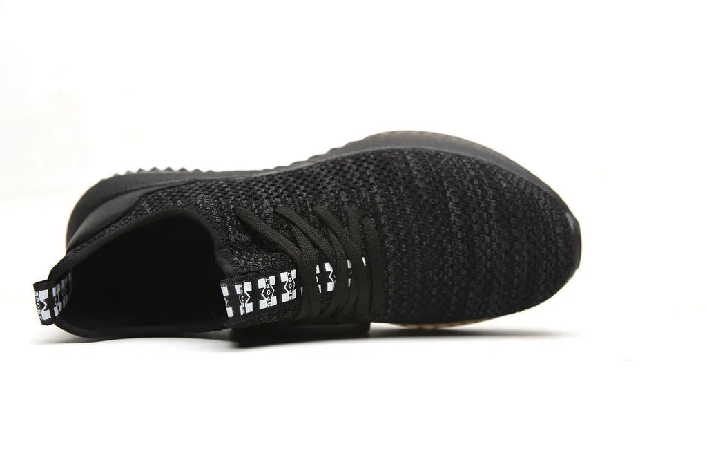 Black low-cut steel toe cap safety work shoes with antistatic EVA sole.
